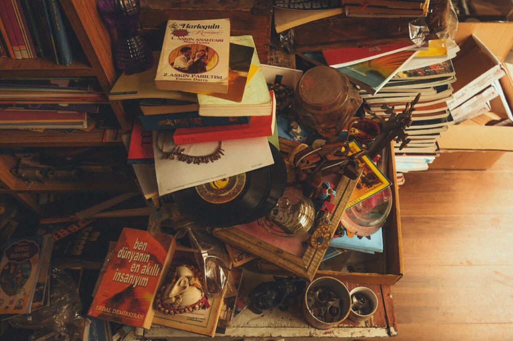 A pile of books and other items on a table